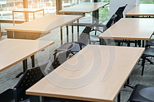 Table in a seminar room arranged in lined.