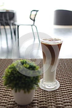 Table serve a glass of cappucino photo