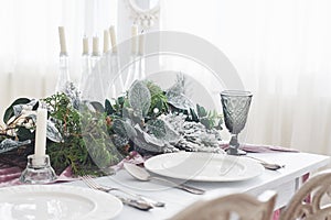 Table served for Christmas dinner in living room, close up view