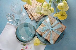 Table served for Passover Pesach indoors, with matzah bread