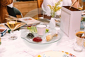 Table served for Passover Seder Pesach. Passover table setting with a traditional Passover seder plate with symbolic