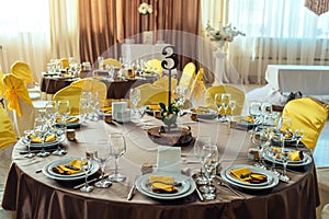Table served for wedding banquet. Table setting. Number of guest.