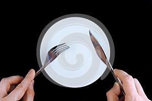 Table serving-knife, fork in hands