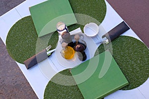 Table and serving in outdoor cafe in summer evening. Summer terrace of restaurant in evening. Top view