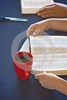 Table Set for a Bible Study as People Search the Scriptures