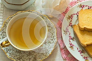 Table set for breakfast or a snack with tea and rusks