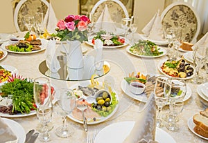 Table set for celebration in classic style with meal