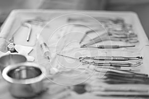 Table with a set of dental surgical instruments