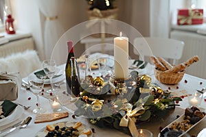 A table set for dinner meal at Christmas time.