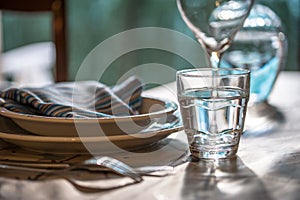 Table set for dinning with white porcelaine dishes, vinta