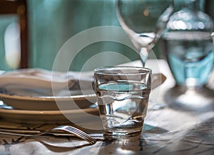 Table set for dinning with white porcelaine dishes, vinta