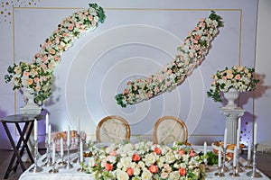 Table set for event party or white flowers wedding reception . Wedding banquet in restaurant, tables with flowers and