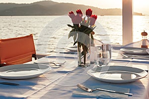 Table set with flowers at beach restaurant