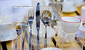 Table set: fork, spoon, knife and cup