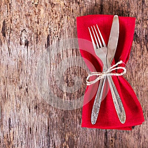 table set with red napkin.