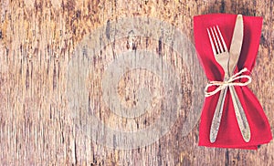 table set with red napkin.