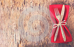 table set with red napkin.