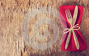 table set with red napkin.