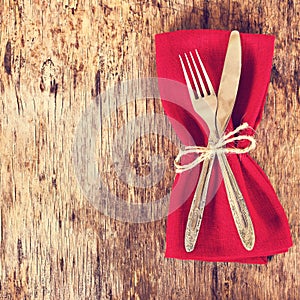 table set with red napkin.