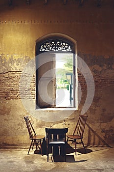 table set under the antique window