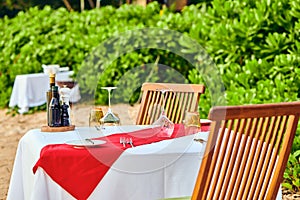 Table set up for romantic dinner on beach at Seychelles