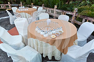 Table set for wedding or another catered event dinner, luxury wedding table setting for fine dining at outdoors.