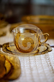Table setting with antique tea glass set with filigree pattern.
