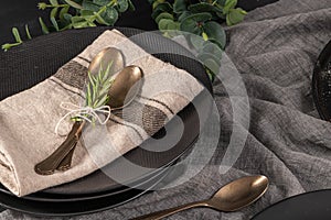 Table setting background with copy space. Background with napkin, silverware and rosemary branch. Cutlery with spoon