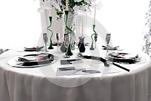 Table setting with black tableware. Serving table prepared for event party or wedding