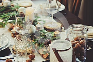 Table setting for celebration Christmas and New Year Holidays. Festive table at home with rustic details