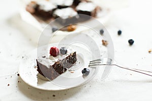 Table setting, chocolate dessert brownie cake with berries