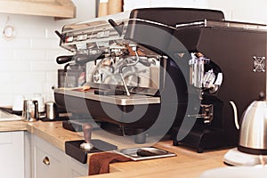 A table setting for coffee on the counter at a coffee house