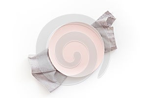 Table setting for dinner. Empty plate on napkin - dishware top view
