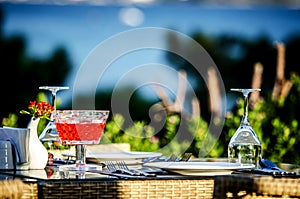 Table setting before dinner in a restaurant on the beach.