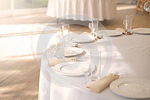 Table setting element empty plates with cutlery on white tablecloth
