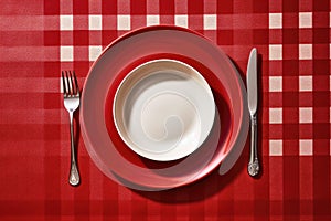 table setting on a festive New Year's table in red colors.