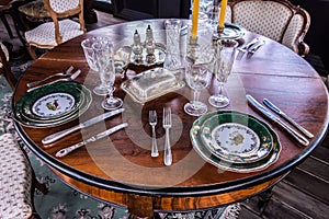 Table setting. In the foreground plate, fork, spoon, knife