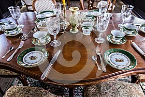 Table setting. In the foreground plate, fork, spoon, knife