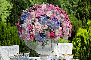 Table setting at a luxury wedding reception in the garden