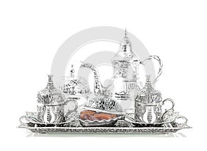 Table setting with silver tableware and dates. Oriental hospital