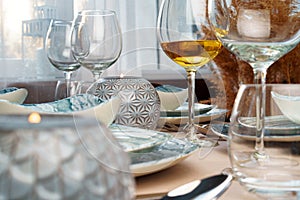 Table setting with stylish dishware on beige tablecloth