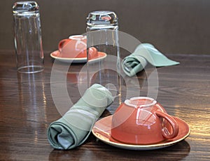 Table setting for two - Landscape; focus on front cup