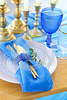 Table setting in vintage style is decorated with candles