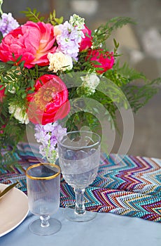 Table setting in vintage style is decorated with flowers
