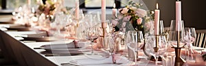 Table setting for a wedding. Glasses and plates for a romantic dinner, festive atmosphere with flowers and candles.