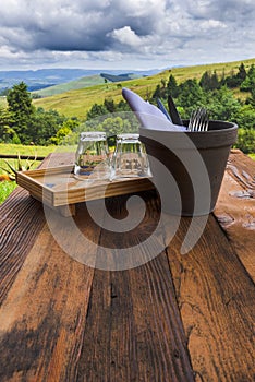 Table settings at a restaurant with a rural background