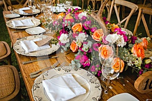 Table setup, wedding guest table, reception layout in pantone living coral and deer horns rustic style