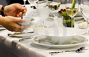 Table side service at a fine dining restaurant, Waiter serving dishes to the table