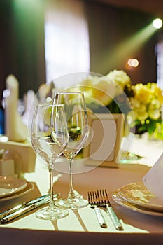 table with sign for number or names of guests in banquet hall of restaurant.