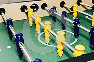 Table soccer. Game figures football players close up. An entertaining game for football fans.